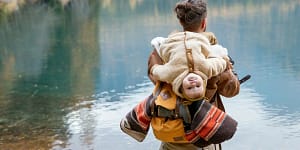 Photo Of Man Carrying Baby